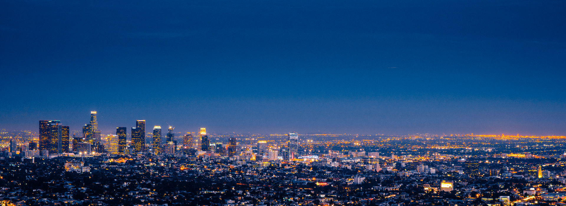 Cityscape of Los Angeles at night where the Family Real Estate Network office is located