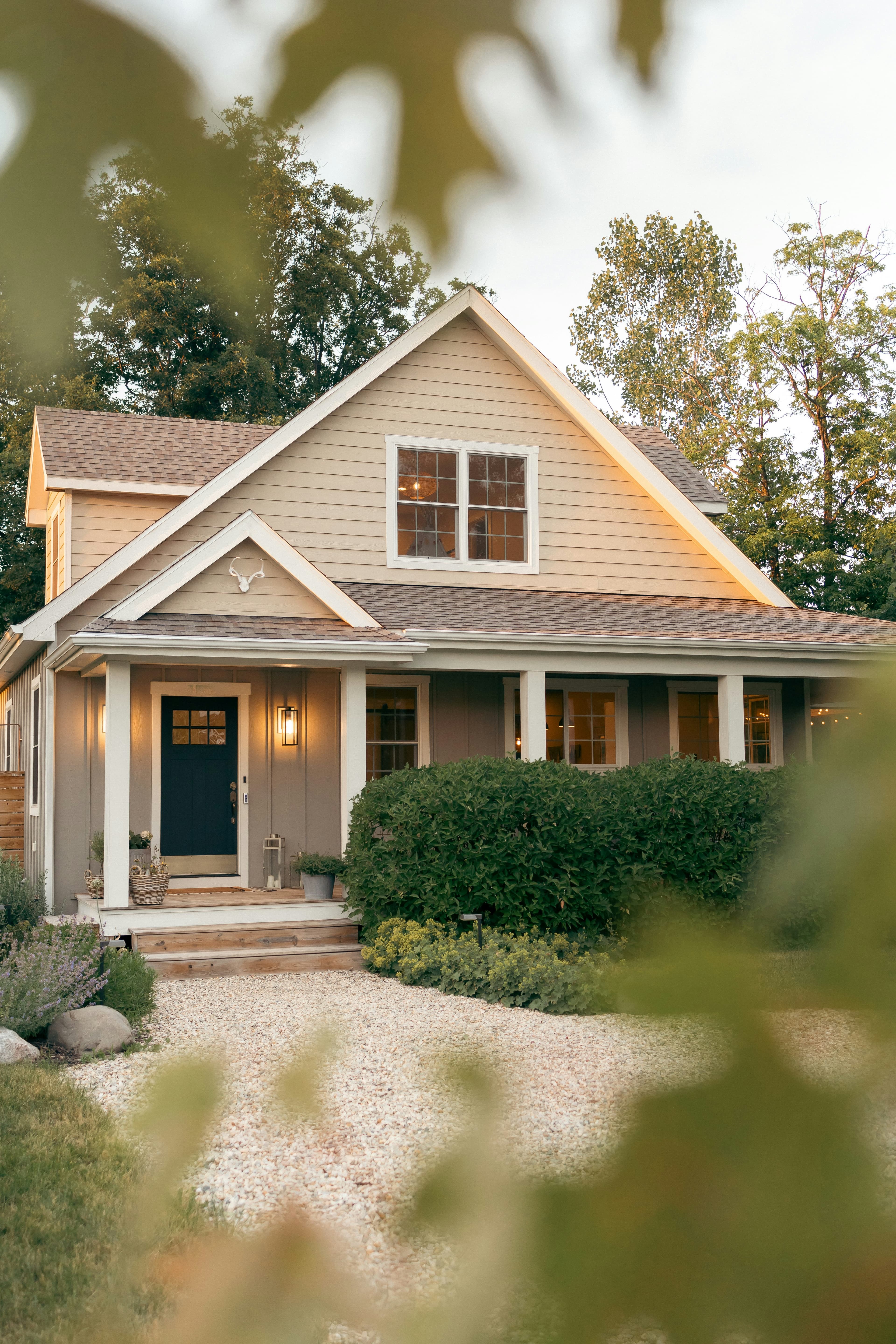 Brown home with white trim and porch